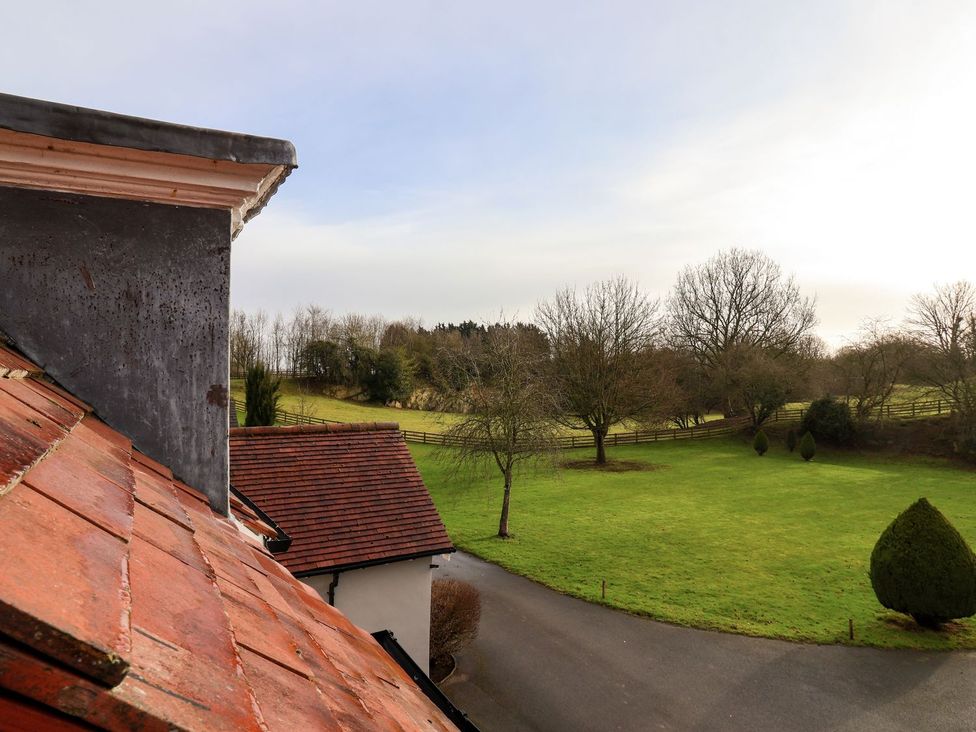 View of grass field and trees from above at The Bothy in Knaresborough