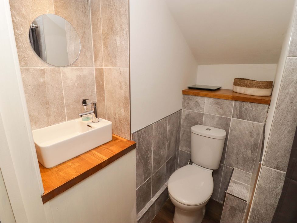 A bathroom with a sink and toilet at No.8 Millmoor Farm Cottage in Broad Haven