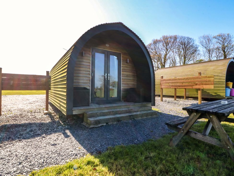 A pod with a door and steps at Bron Eifion Pod 1 Criccieth