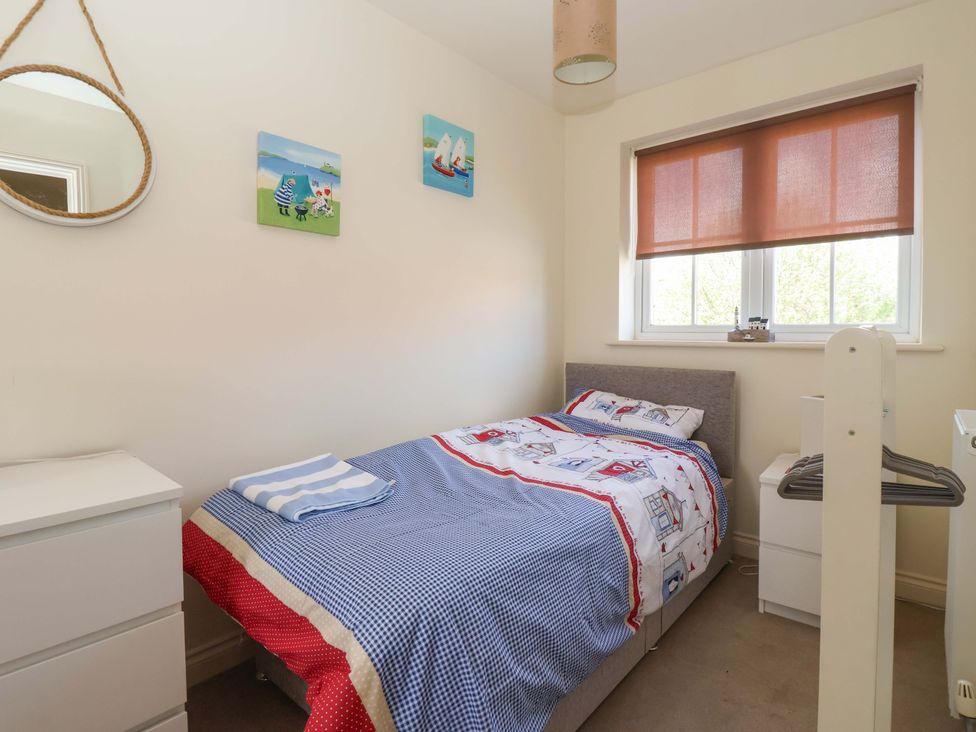 A bedroom with a bed and dresser at 4 Perran Court in Filey