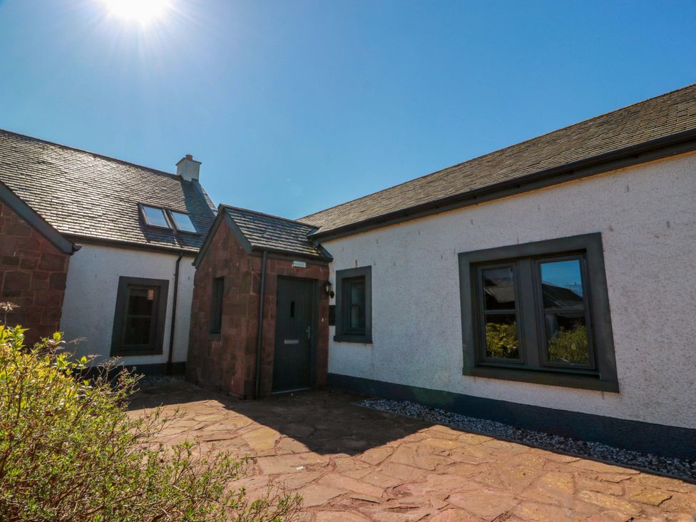An exterior view of a house with a pathway at Ballaganlea in Alexandria