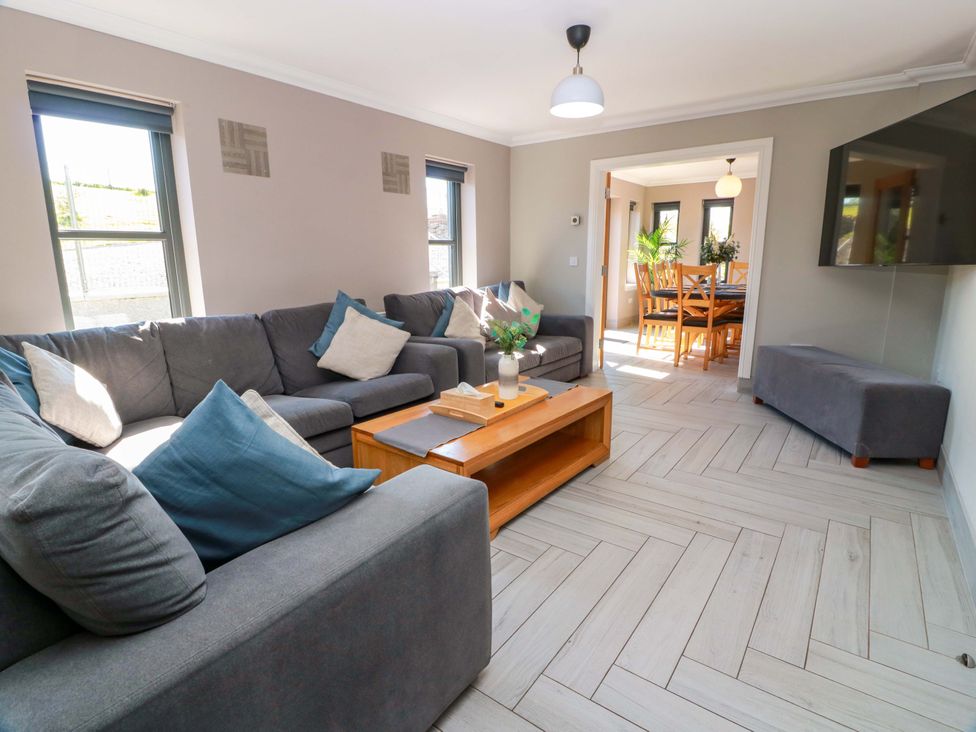 A living room with a sofa and coffee table at Ballaganlea in Alexandria