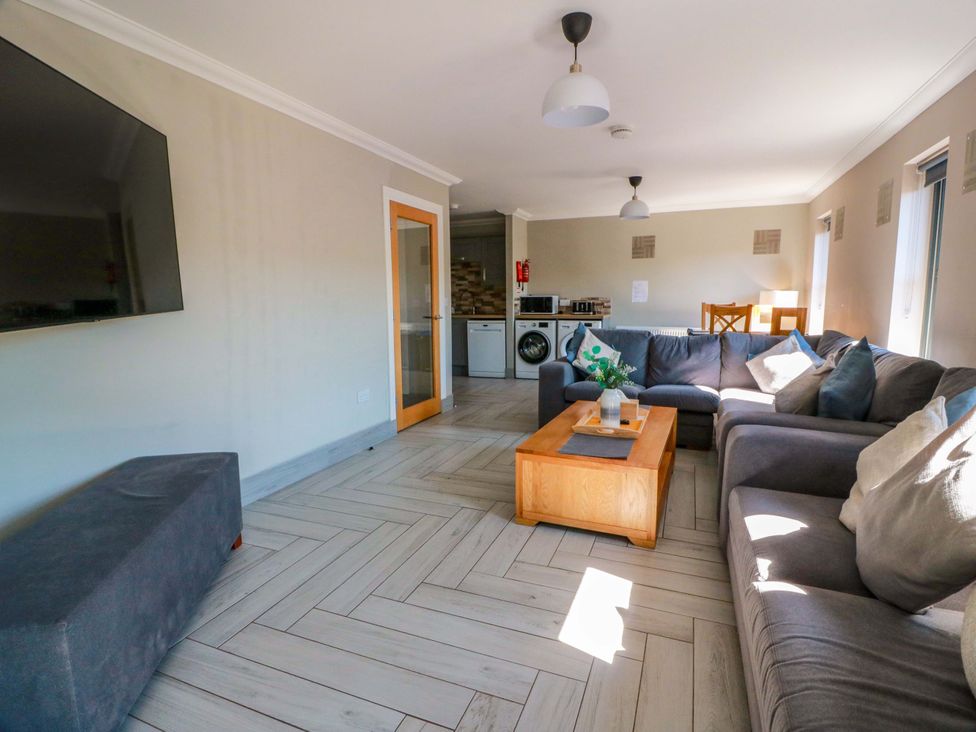 A living room with a sofa and coffee table at Ballaganlea in Alexandria