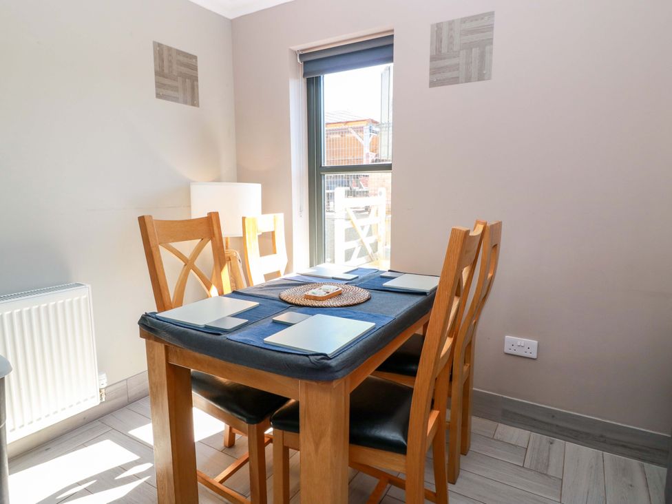 A dining room with a table and chairs at Ballaganlea in Alexandria