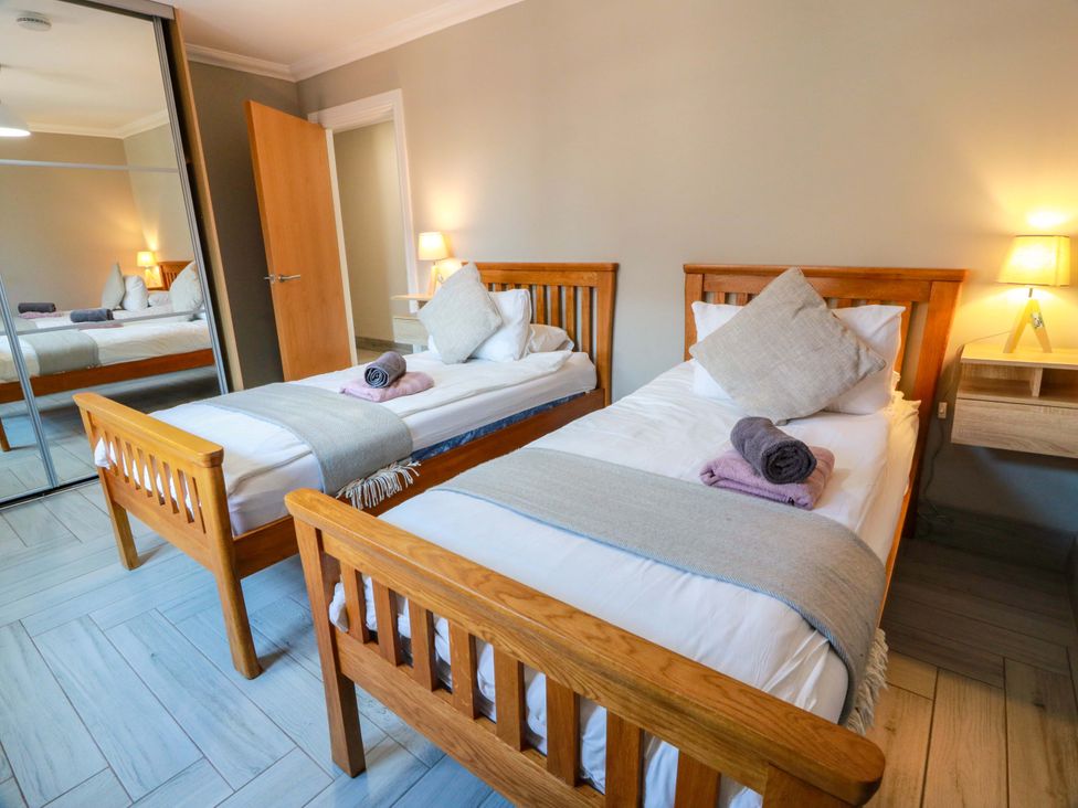 A bedroom with two beds and a nightstand at Ballaganlea in Alexandria