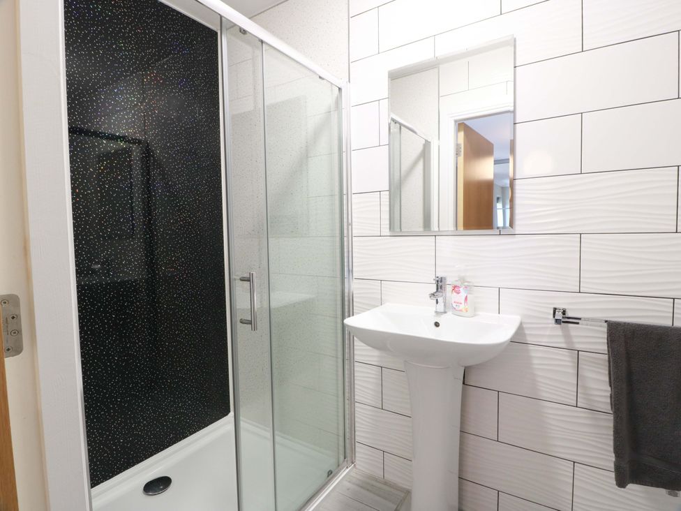 A bathroom with a shower and sink at Ballaganlea in Alexandria