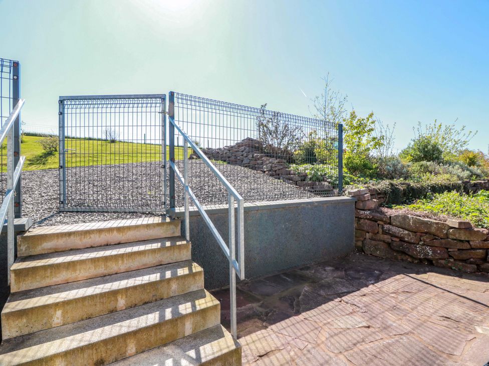 An outdoor area with stairs and a gate at Ballaganlea in Alexandria