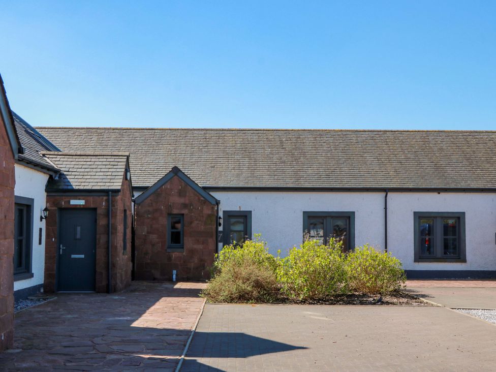 An outdoor view of a building with windows and a pathway at Ballaganlea in Alexandria