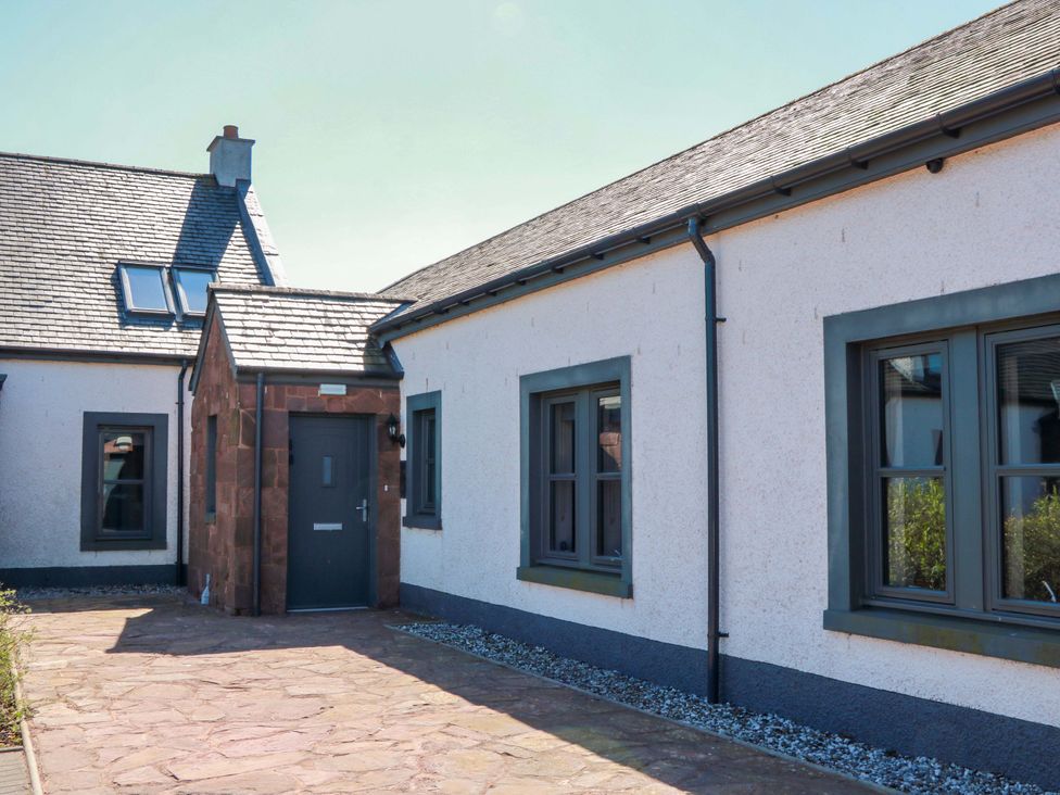 An exterior view of a house with a pathway at Ballaganlea in Alexandria