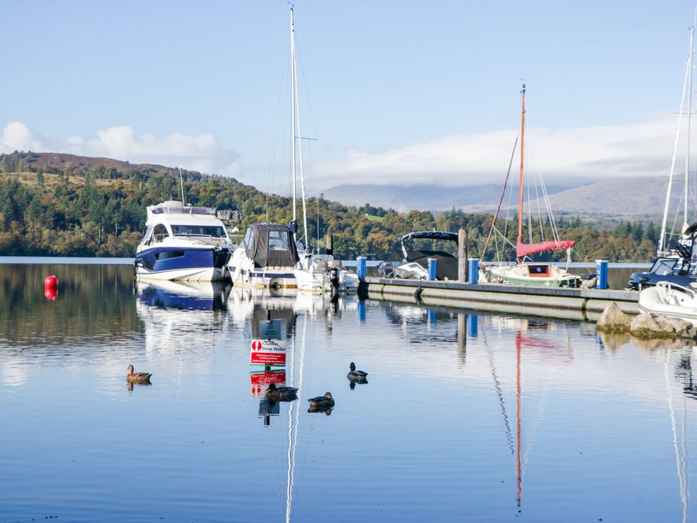 A marina with boats and a sign at Fox Red Retreat Troutbeck Bridge