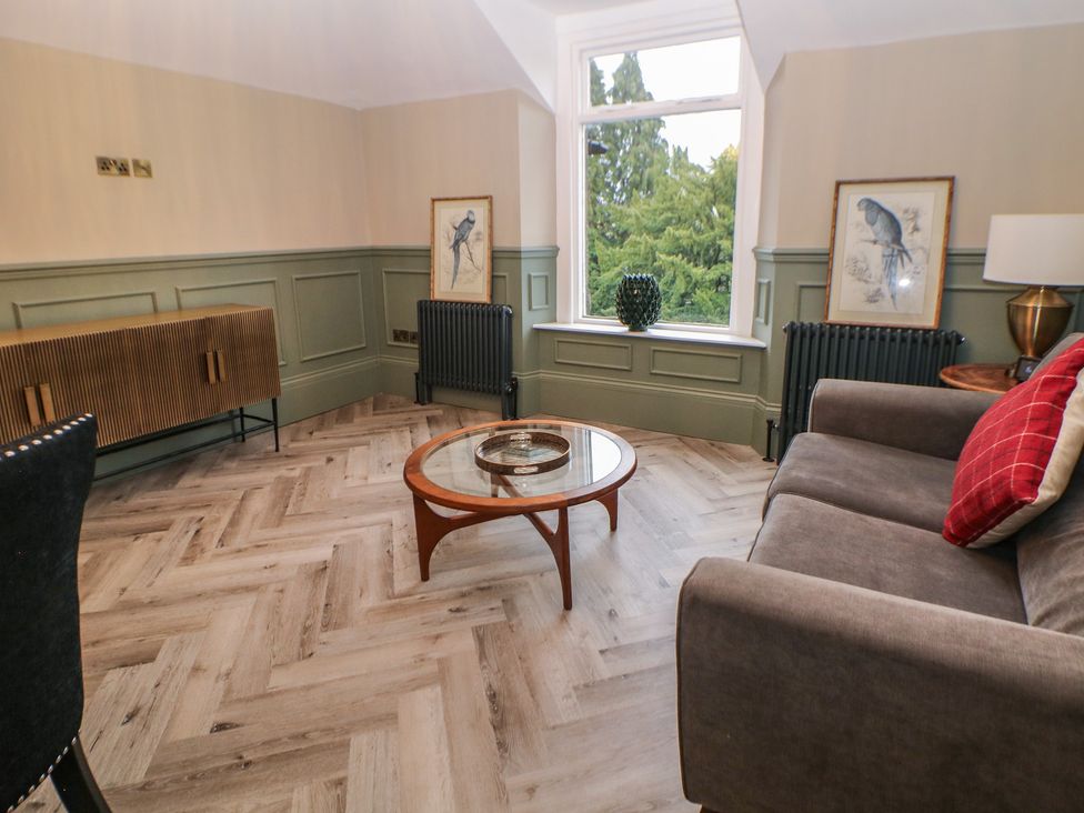 A living room with a coffee table and a sofa at The Loft Suite in Buxton