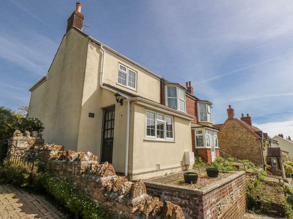 A house with a garden and stone wall at 12 West Street Weymouth