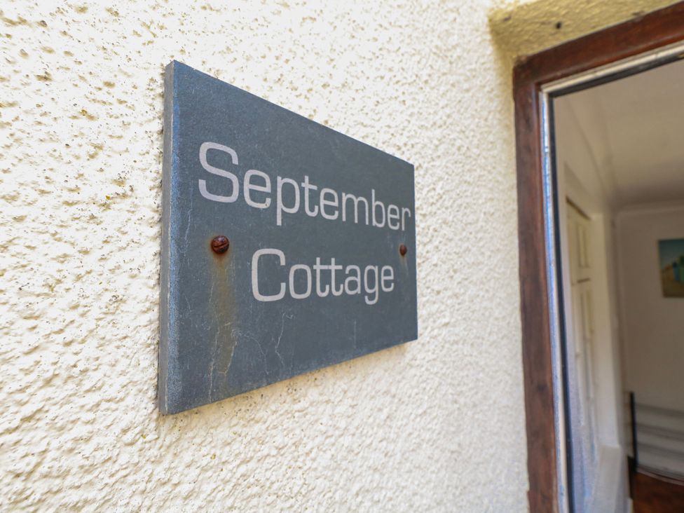A sign reading September Cottage at 12 West Street, Weymouth