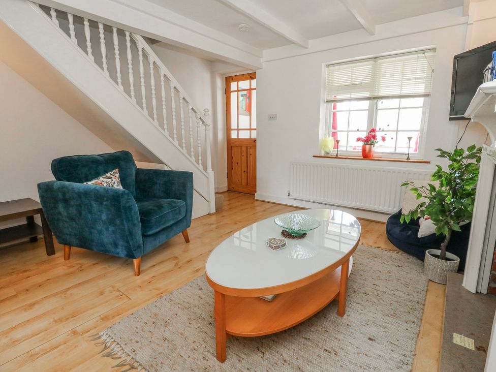 A living room with a coffee table and sofa at 12 West Street in Weymouth