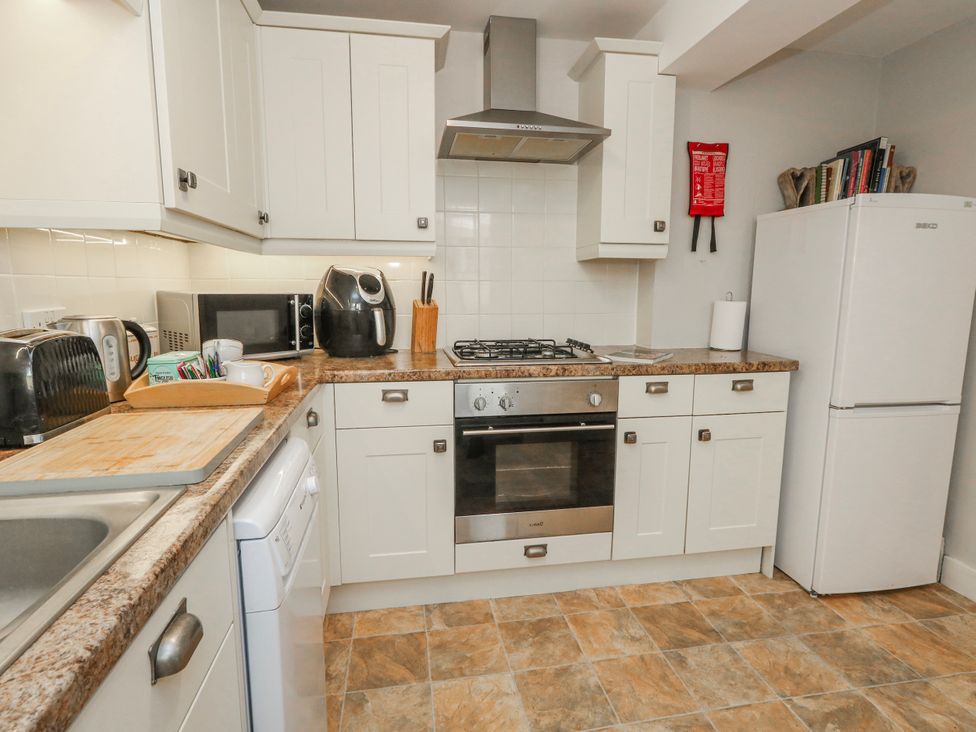 A kitchen with appliances and counter space at 12 West Street in Weymouth