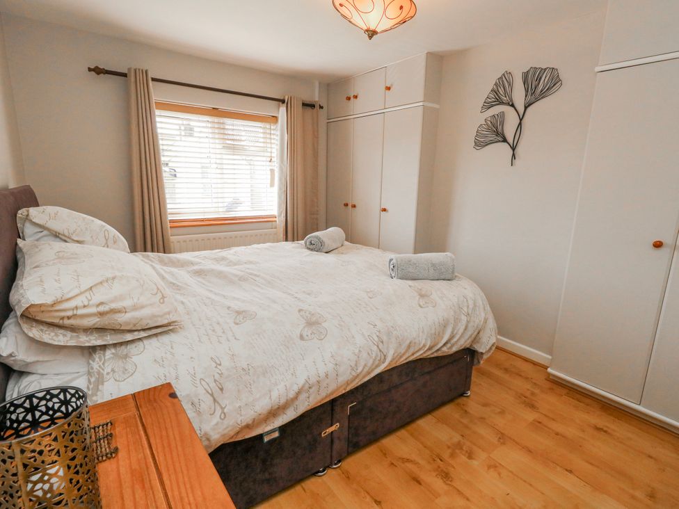 A bedroom with a bed and wardrobe at 12 West Street in Weymouth