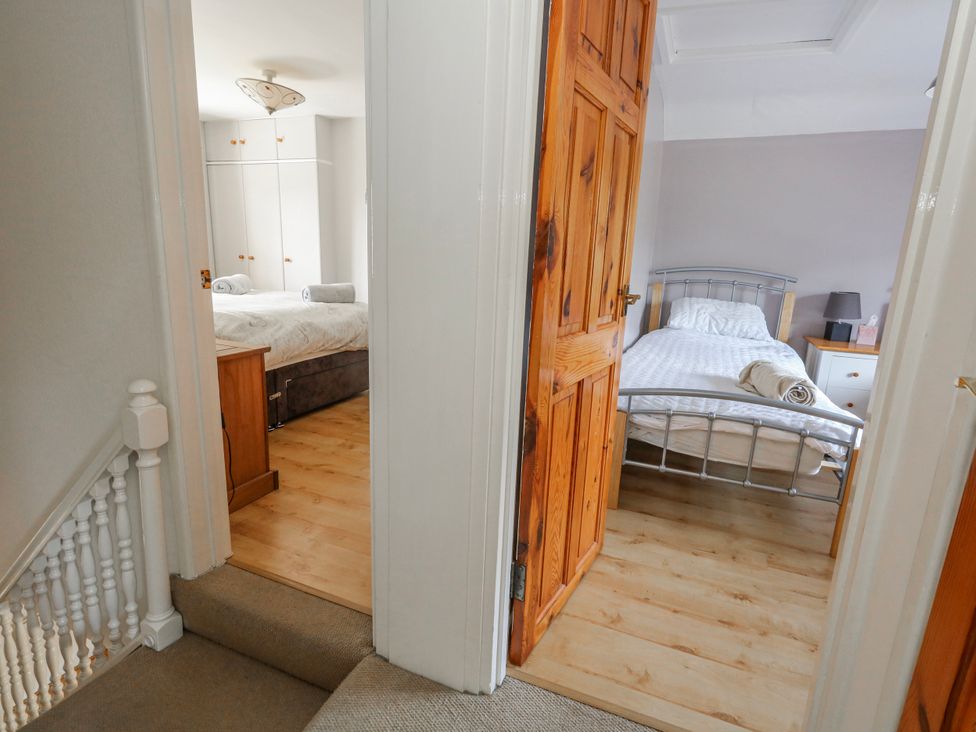 A bedroom with a bed and wardrobe at 12 West Street, Weymouth
