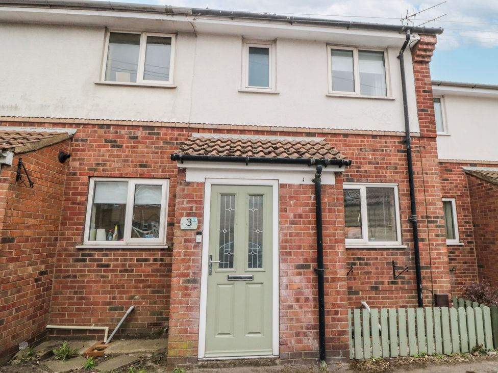 An exterior view of a house with a green door at 3 Beck Mews Scarborough