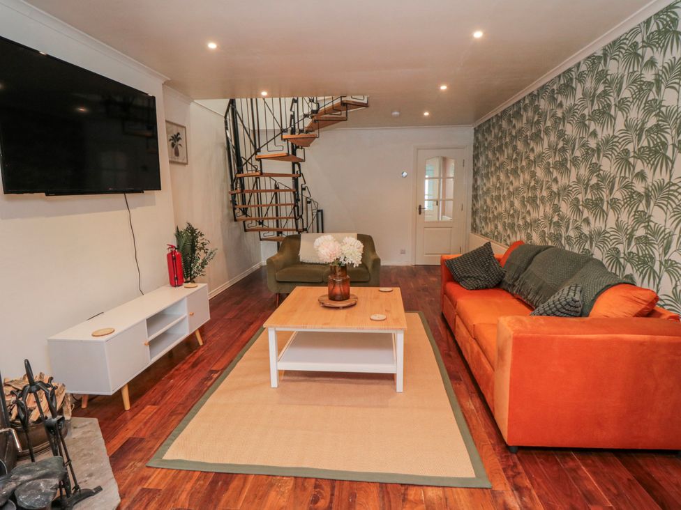 A living room with a television and seating area at 3 Beck Mews Scarborough