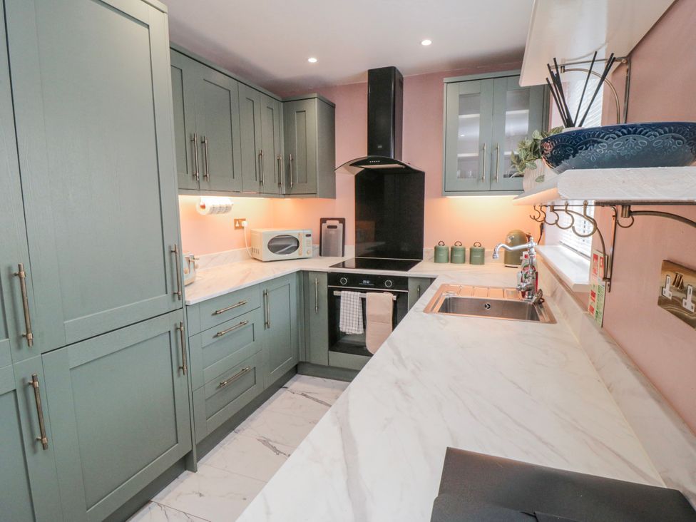 A kitchen with cabinets and appliances at 3 Beck Mews Scarborough