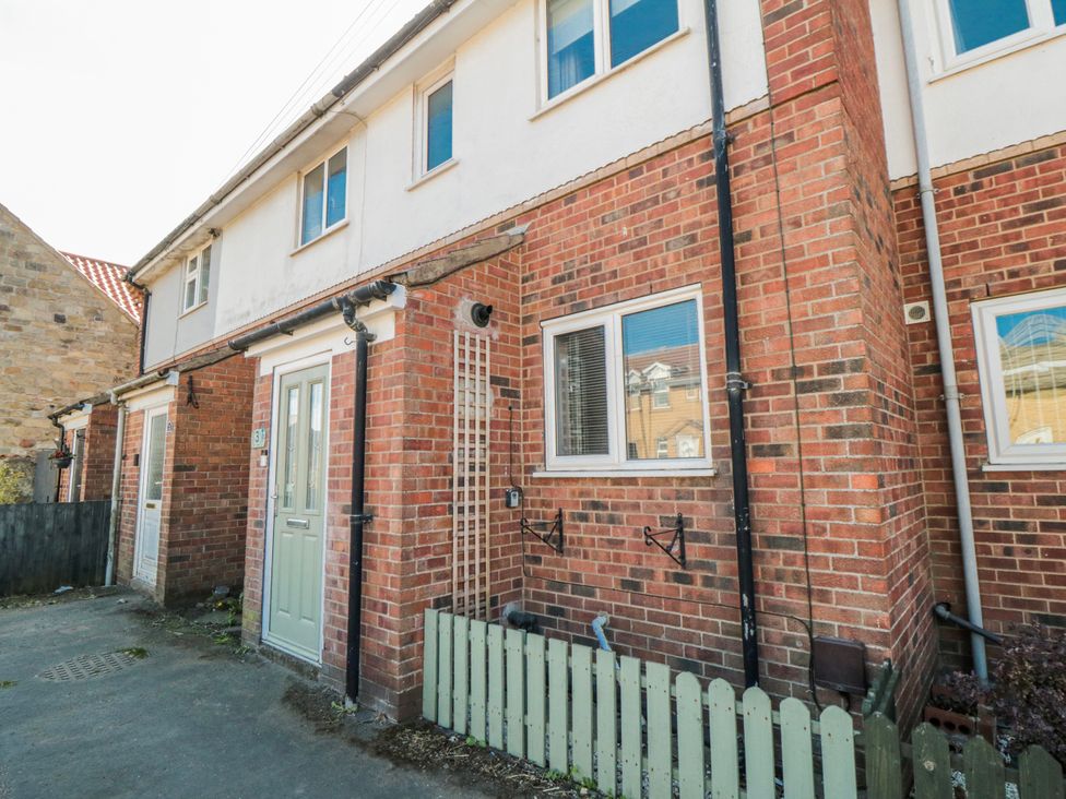 An exterior view of a house with windows and a door at 3 Beck Mews, Cayton