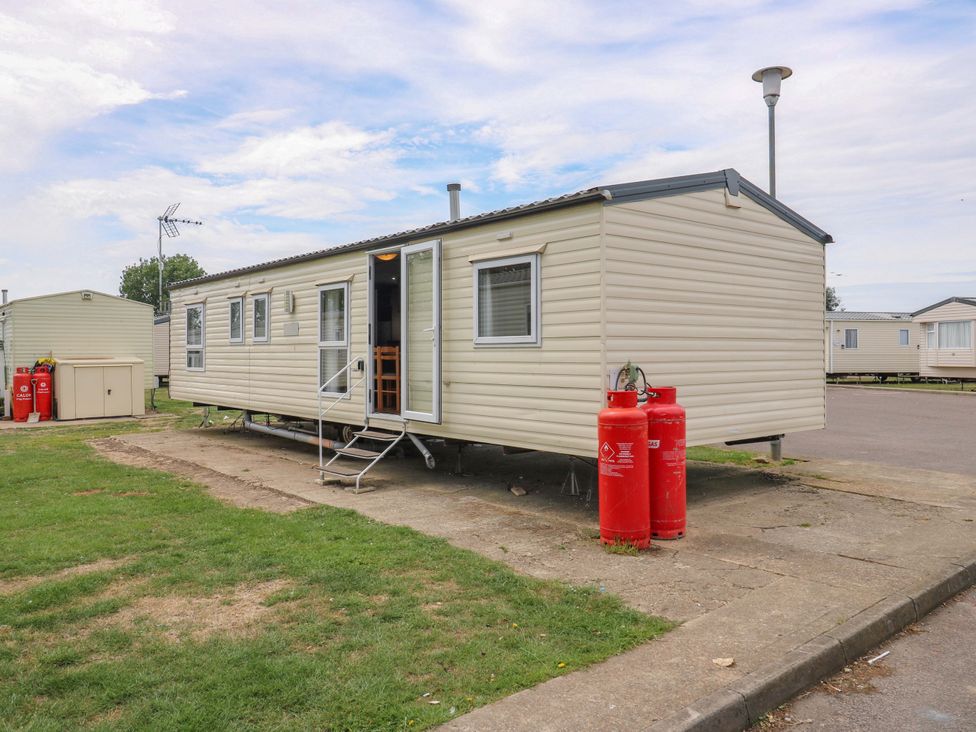 A caravan with gas cylinders at Caravan 102 seawick Clacton-on-Sea