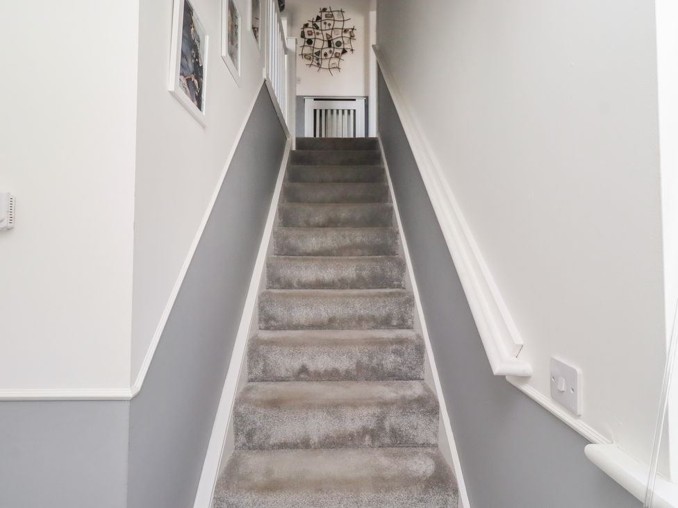 A staircase leading to a landing at 26 Field Court