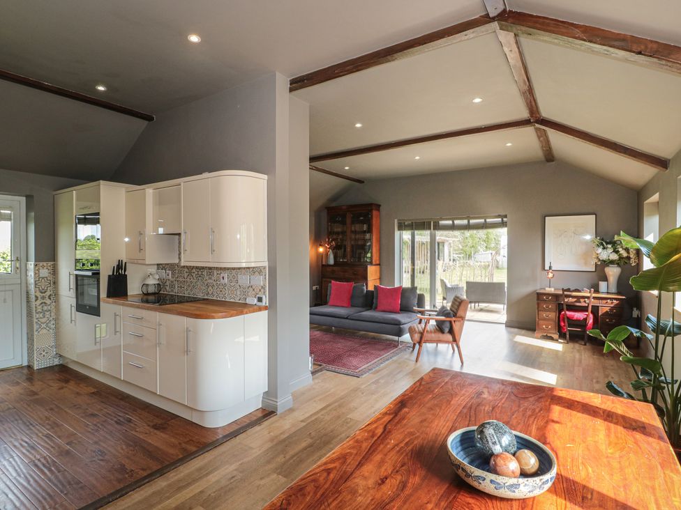 A kitchen and living room with furniture and decor at Annex at Barnfield House in Devizes