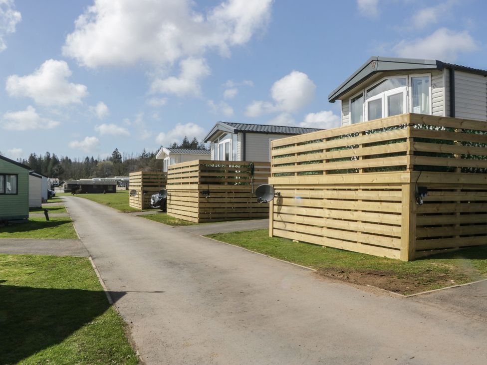 Caravans lined along a road at Lochwood Platinum Superior at Three Lochs Holiday Park in Newton Stewart