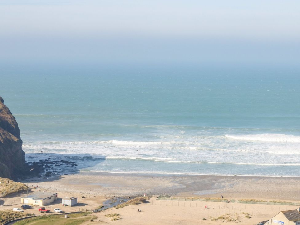 A view of the beach and ocean at Primrose Cottage in Redruth