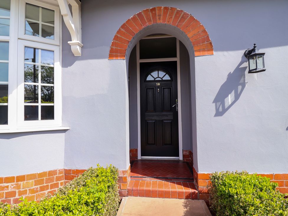 An entrance with a front door and window at 18 Crewe Road in Crewe