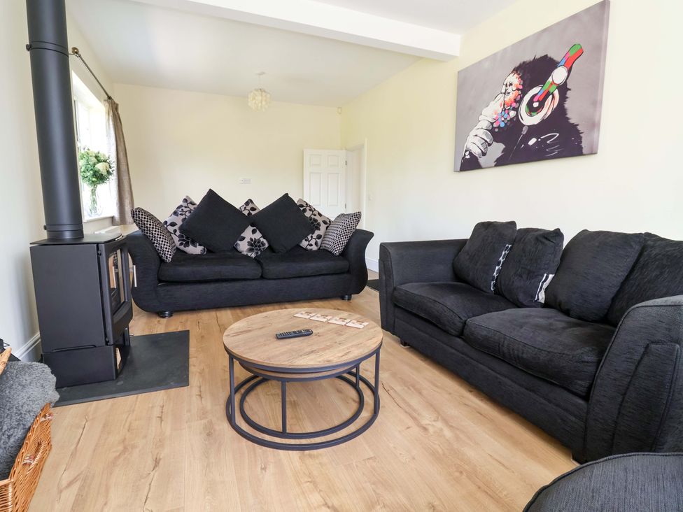 A living room with sofas and a coffee table at 18 Crewe Road, Crewe