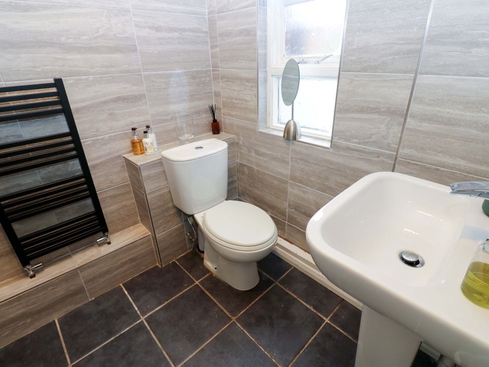 A bathroom with a toilet and sink at 17 Fairfield Road