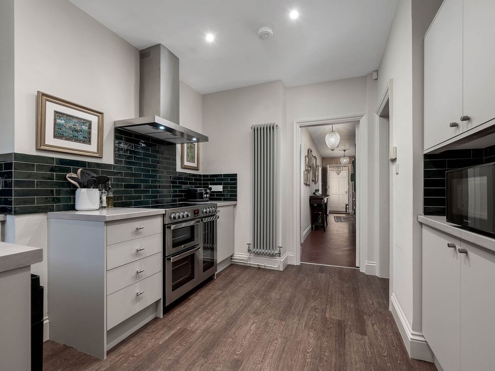 A kitchen with appliances and a counter at Greenwood Manor in Peterborough