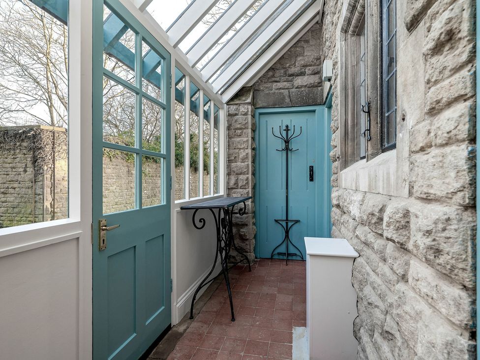 An entrance with a door and table at Greenwood Manor in Peterborough