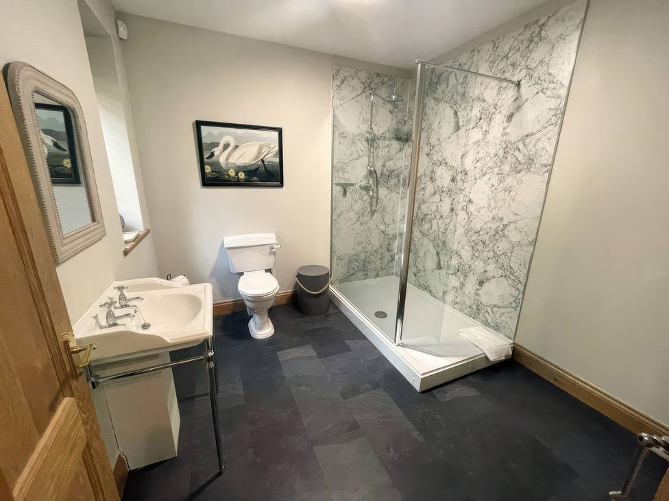 A bathroom with a shower and sink at The Lady Rothschild Stables in Peterborough