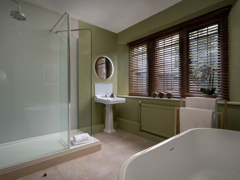 A bathroom with a shower, sink and bathtub at Rubens Rooms in Peterborough