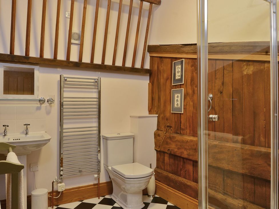 A bathroom featuring a sink, toilet, and shower at The Lady Rothschild Dairy in Peterborough