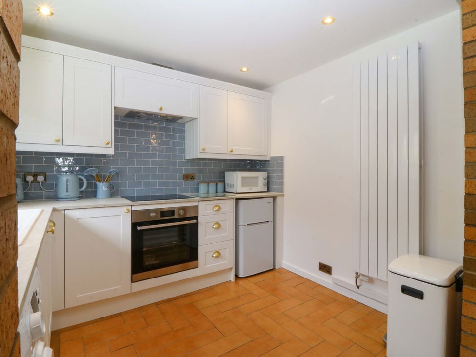 A kitchen with appliances and fixtures at Cil Y Coed Star near Llanfairpwllgwyngyll