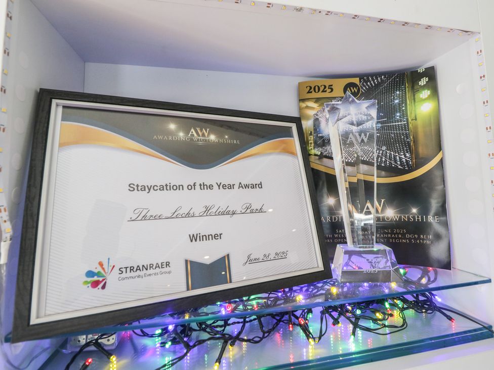 An award certificate and trophy displayed at Standard Caravan at Three Lochs Holiday Park Newton Stewart