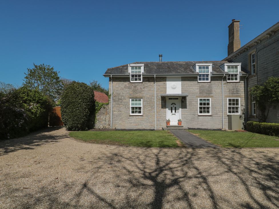 A house with windows and a pathway at The Little Vicarage in Highbridge