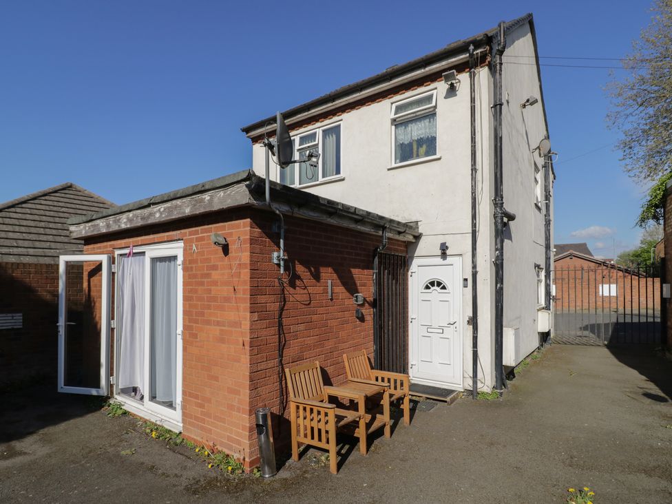 An outdoor area with a table and chairs at 32B Cramp Hill in Darlaston