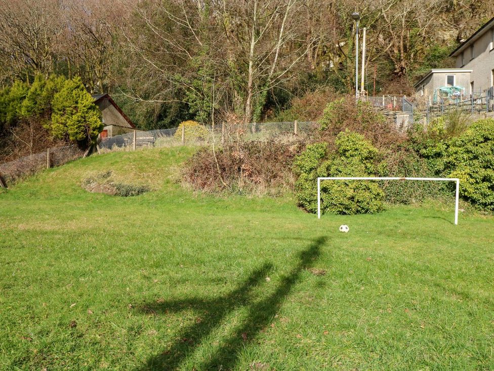 A soccer field with a ball and goal posts at 2 Bryn Eglwys Prenteg near Porthmadog