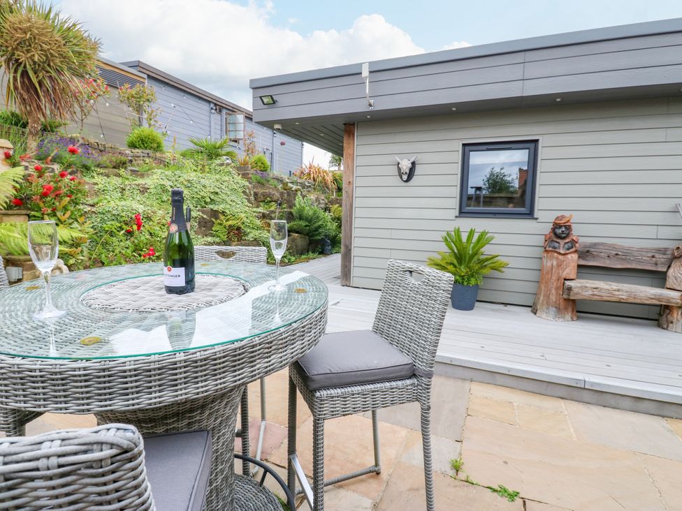 An outdoor area with a table and chairs at Caesars Lodge, Houghton Bank near Heighington