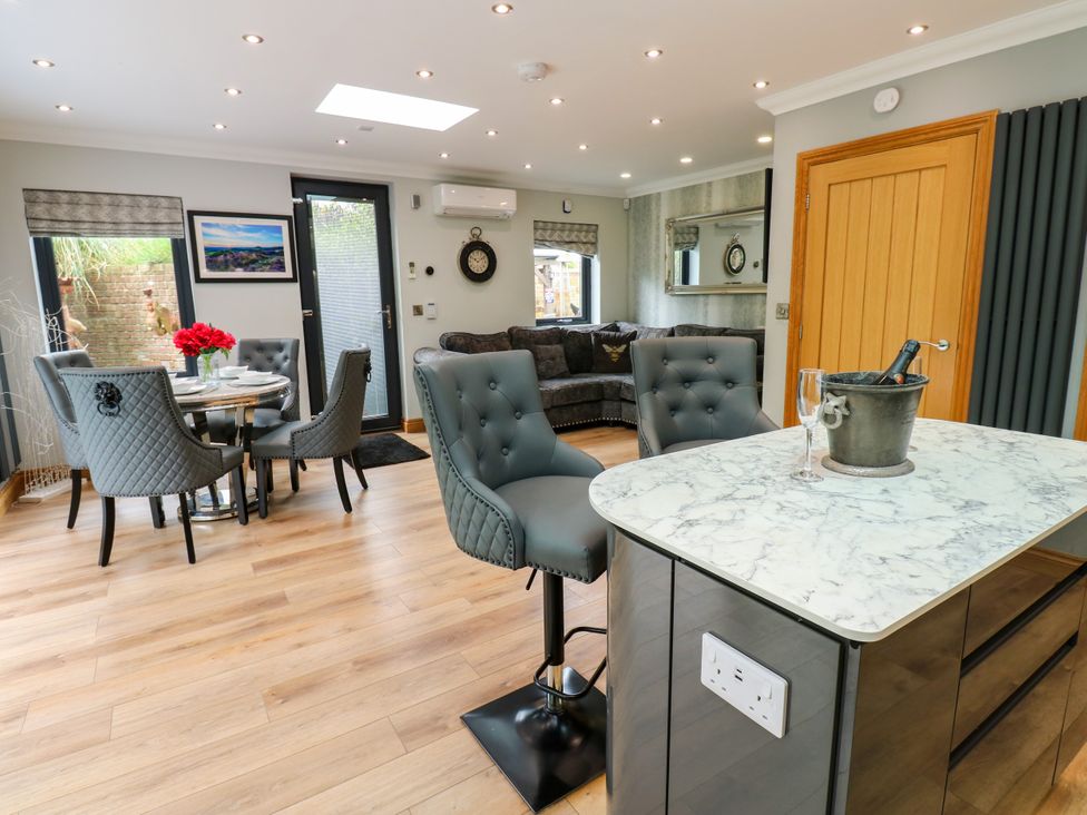 A dining area with table and chairs at Caesars Lodge in Houghton Bank near Heighington