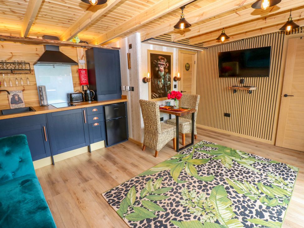 A living room with a kitchenette and dining area at Black River Houghton Bank near Heighington