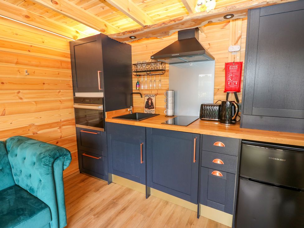 A kitchen with cabinets, sink, and appliances at Black River in Houghton Bank near Heighington