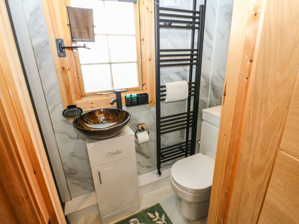 A bathroom with a sink and toilet at Black River in Houghton Bank near Heighington