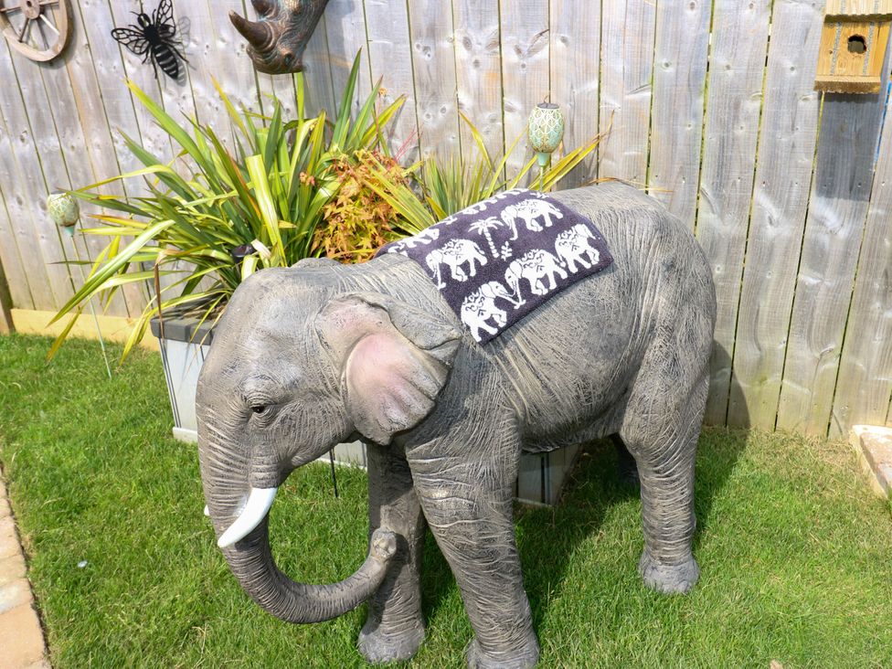 A garden with an elephant statue and plant at Black River in Houghton Bank near Heighington