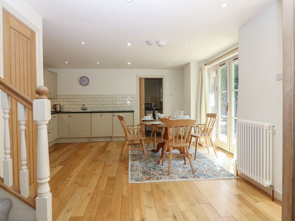 A dining area with a table and chairs at Hollybank Barn near Melrose